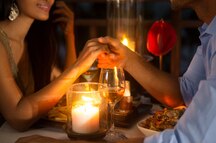 Couple enjoying a romantic dinner in Goa Couple enjoying a romantic dinner in Goa