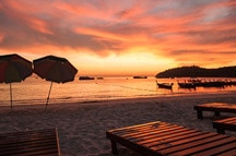 Sunbeds on the beach at Sunset Sunbeds on the beach at Sunset
