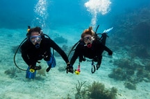 A couple scuba diving in Goa A couple scuba diving in Goa