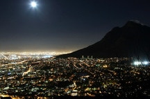 Cape Town city at night with moon in the sky Cape Town city at night with moon in the sky
