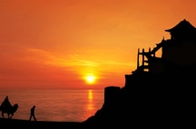 SIlhouette of Caravan travelers riding Camels SIlhouette of Caravan travelers riding Camels