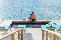 Couple enjoying the sea view at the Holiday Inn Resort Kandooma Couple enjoying the sea view at the Holiday Inn Resort Kandooma